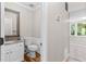 Cozy bathroom with white cabinets, granite sink and vanity plus hardwood floors and tile at 1428 Brookcliff Dr, Marietta, GA 30062