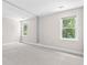 Bedroom featuring multiple windows that provide natural light and neutral walls at 1428 Brookcliff Dr, Marietta, GA 30062