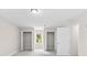 Bright bedroom featuring two closets, a window, and neutral color scheme at 1428 Brookcliff Dr, Marietta, GA 30062
