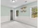Bedroom with two windows, wood floating shelves, and view of outside at 1428 Brookcliff Dr, Marietta, GA 30062