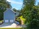 Exterior of home featuring an attached garage, private drive, and mature trees at 1428 Brookcliff Dr, Marietta, GA 30062