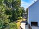 Home exterior featuring an attached garage, deck and large private backyard at 1428 Brookcliff Dr, Marietta, GA 30062