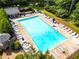 Aerial view of a large pool and gazebo surrounded by lounge chairs and mature trees at 1428 Brookcliff Dr, Marietta, GA 30062