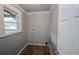 Dedicated laundry room with wood-look tile flooring and utility hookups at 1852 E Farris Ave, Atlanta, GA 30344