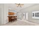 Home interior with a wooden bar area, stools, built in cabinetry, and access to the outdoors at 6771 Sunny Brook Ln, Atlanta, GA 30328