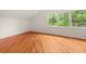 Bright bedroom with hardwood floors and multiple windows providing ample natural light at 6771 Sunny Brook Ln, Atlanta, GA 30328