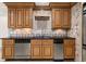 The traditional style kitchen features granite countertops, stainless appliances, and custom wood cabinetry at 6771 Sunny Brook Ln, Atlanta, GA 30328