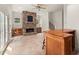 Spacious living room with a stone fireplace, built-in shelving, and glass paneled doors at 6771 Sunny Brook Ln, Atlanta, GA 30328