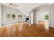 Living room with hardwood floors, stone fireplace, and access to a balcony at 6771 Sunny Brook Ln, Atlanta, GA 30328