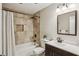This bathroom features a bathtub and shower combo, a decorative tile wall, and a large mirror at 85 Dunwoody Springs Dr, Sandy Springs, GA 30328