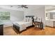 Comfortable bedroom with hardwood floors, ceiling fan, and ample natural light at 85 Dunwoody Springs Dr, Sandy Springs, GA 30328