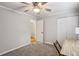 Neutral bedroom with ceiling fan, carpeted floor, and a door to a walk-in closet for extra storage at 85 Dunwoody Springs Dr, Sandy Springs, GA 30328