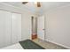 This bedroom has a ceiling fan, neutral carpet, and closet at 85 Dunwoody Springs Dr, Sandy Springs, GA 30328