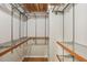 A walk-in closet with wire shelving and wooden trim and a wood ceiling at 85 Dunwoody Springs Dr, Sandy Springs, GA 30328