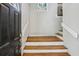 Bright foyer with hardwood stairs and a decorative stained glass window above the entryway at 85 Dunwoody Springs Dr, Sandy Springs, GA 30328