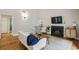 Bright living room with hardwood floors, fireplace, and comfortable seating area at 85 Dunwoody Springs Dr, Sandy Springs, GA 30328