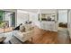 Open-concept living room with hardwood floors and views into dining and kitchen areas at 85 Dunwoody Springs Dr, Sandy Springs, GA 30328