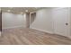 Finished basement space with stairs, new flooring, recessed lighting, and ample room at 100 Percheron Dr, Canton, GA 30114