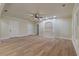 Spacious bonus room with a ceiling fan, neutral walls, new flooring, and a built-in shelving unit at 100 Percheron Dr, Canton, GA 30114