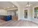 Bright dining area is open to kitchen and living room featuring backyard access and modern light fixture at 100 Percheron Dr, Canton, GA 30114