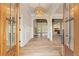 Elegant foyer boasts hardwood floors, arched doorways, and a stylish pendant light at 100 Percheron Dr, Canton, GA 30114