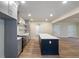 Open kitchen showcases gray cabinets, quartz counters, stainless appliances, and a large island at 100 Percheron Dr, Canton, GA 30114