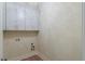 This laundry room includes upper cabinets, stylish hardware and a light fixture at 100 Percheron Dr, Canton, GA 30114