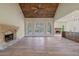 Spacious living room with vaulted wood ceiling, fireplace, and seamlessly flowing to kitchen at 100 Percheron Dr, Canton, GA 30114