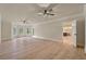 Spacious living room featuring wood-look flooring, ceiling fans, and ample natural light at 100 Percheron Dr, Canton, GA 30114