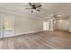 Spacious living room featuring wood-look flooring, ceiling fans, and neutral-toned walls at 100 Percheron Dr, Canton, GA 30114