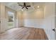 Spacious living room featuring coffered ceilings, paneling, and hardwood floors at 100 Percheron Dr, Canton, GA 30114