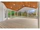 Expansive screened-in porch featuring wood ceiling, tongue and groove floor, and outdoor views at 100 Percheron Dr, Canton, GA 30114