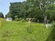 Expansive backyard with lush greenery, offering ample space for outdoor activities and potential landscaping at 6380 Mableton Sw Pkwy, Mableton, GA 30126