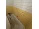 Compact bathroom showcasing a tub with tiled walls at 6380 Mableton Sw Pkwy, Mableton, GA 30126