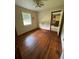 Cozy bedroom with hardwood floors and natural light at 6380 Mableton Sw Pkwy, Mableton, GA 30126