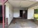 Carport with some deferred maintenance, providing sheltered parking and storage space at 6380 Mableton Sw Pkwy, Mableton, GA 30126