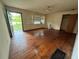 Spacious living room with hardwood floors, natural light, and classic ceiling fan at 6380 Mableton Sw Pkwy, Mableton, GA 30126