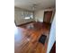 Bright living room featuring hardwood floors, a classic ceiling fan, and natural light at 6380 Mableton Sw Pkwy, Mableton, GA 30126