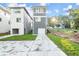 Modern new construction home with a gray facade and a white garage door and freshly planted lawn at 1697 Thomas St, Decatur, GA 30032