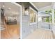 Open-concept living space featuring gleaming hardwood floors and stairs leading to the second floor at 1697 Thomas St, Decatur, GA 30032