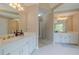 Bathroom with double vanity sinks, white cabinets and gold hardware at 1765 Pinetree Pass Lane Southwest Sw Ln, Lilburn, GA 30047