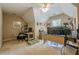 Bright, carpeted bonus room featuring multiple desks, ceiling fan, and natural light at 1765 Pinetree Pass Lane Southwest Sw Ln, Lilburn, GA 30047
