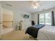 Bedroom with a ceiling fan and window overlooking the backyard at 1765 Pinetree Pass Lane Southwest Sw Ln, Lilburn, GA 30047