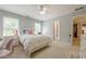 Bedroom with a ceiling fan and dual windows that provide natural light at 1765 Pinetree Pass Lane Southwest Sw Ln, Lilburn, GA 30047