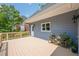 Side view of the deck with plants and a view of the exterior of the home at 1765 Pinetree Pass Lane Southwest Sw Ln, Lilburn, GA 30047