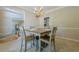 Elegant dining room with chandelier and table, plus an open view into other rooms at 1765 Pinetree Pass Lane Southwest Sw Ln, Lilburn, GA 30047