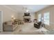 Spacious living room with comfortable seating, a fireplace, and lots of natural light at 1765 Pinetree Pass Lane Southwest Sw Ln, Lilburn, GA 30047