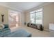 Bright living room showcasing neutral decor, comfortable seating, and views of the staircase and outdoors at 1765 Pinetree Pass Lane Southwest Sw Ln, Lilburn, GA 30047