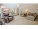 Large living room with neutral colors and lots of comfortable seating, perfect for gatherings at 1765 Pinetree Pass Lane Southwest Sw Ln, Lilburn, GA 30047