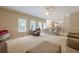 Bright, airy living room with neutral tones, ample seating, and abundant natural light at 1765 Pinetree Pass Lane Southwest Sw Ln, Lilburn, GA 30047